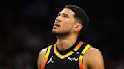 Apr 9, 2025; Phoenix, Arizona, USA; Phoenix Suns guard Devin Booker (1) reacts after a play against the Oklahoma City Thunder during the first half at Footprint Center. Mandatory Credit: Mark J. Rebilas-Imagn Images