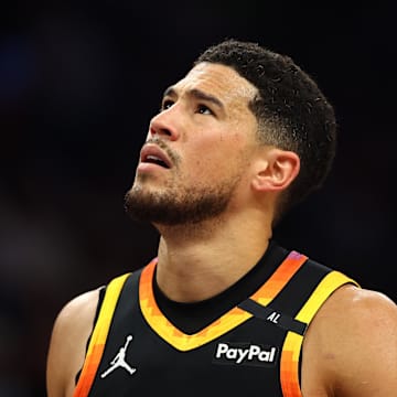 Devin Booker reacts after a play against the Thunder this past season.