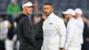 Oct 14, 2023; South Bend, Indiana, USA; USC Trojans head coach Lincoln Riley and Notre Dame Fighting Irish head coach Marcus Freeman chat before the game at Notre Dame Stadium. 