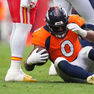 Oct 29, 2023; Denver, Colorado, USA; Denver Broncos linebacker Jonathon Cooper (0) following his fumble recovery in the second quarter against the Kansas City Chiefs at Empower Field at Mile High. Mandatory Credit: Ron Chenoy-USA TODAY Sports