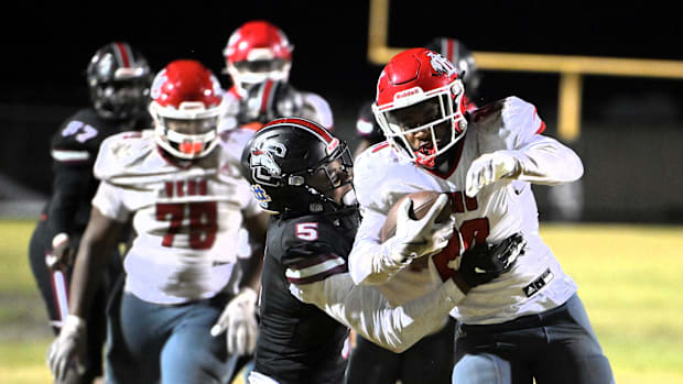 Palm Beach Central's Cameron Dwyer wrestles for a tackle during a regional semi final 21-20 loss to Vero on Nov. 22, 2024.