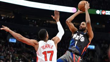 Mar 25, 2024; Toronto, Ontario, CAN;  Brooklyn Nets guard Mikal Bridges (1) shoots the ball over Toronto Raptors guard Garrett Temple (17) in the first half at Scotiabank Arena. Mandatory Credit: Dan Hamilton-USA TODAY Sports