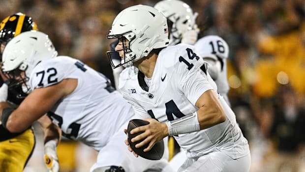 Penn State Nittany Lions quarterback Jaxon Smolik scrambles against the Iowa Hawkeyes at Kinnick Stadium.