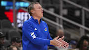 Nov 12, 2024; Atlanta, Georgia, USA; Kansas Jayhawks head coach Bill Self reacts on the bench against the Michigan State Spartans during the first half at State Farm Arena. Mandatory Credit: Dale Zanine-Imagn Images
