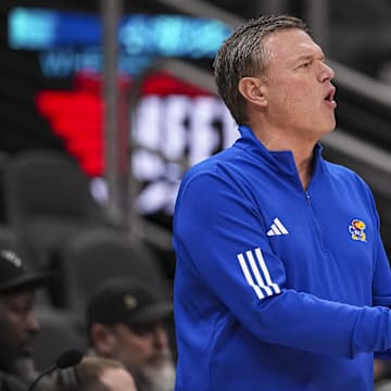 Nov 12, 2024; Atlanta, Georgia, USA; Kansas Jayhawks head coach Bill Self reacts on the bench against the Michigan State Spartans during the first half at State Farm Arena. Mandatory Credit: Dale Zanine-Imagn Images