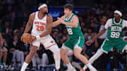 Oct 24, 2025; New York, New York, USA;  New York Knicks forward Guerschon Yabusele (28) is guarded by Boston Celtics guard Hugo Gonzalez (28) during the fourth quarter at Madison Square Garden. Mandatory Credit: Vincent Carchietta-Imagn Images