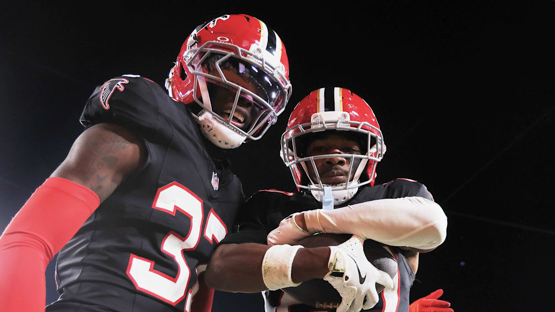 Dec 11, 2025; Tampa, Florida, USA; Atlanta Falcons cornerback Dee Alford (20) poses in the end zone for a photo with cornerback Cobee Bryant (37) after intercepting a pass against the Tampa Bay Buccaneers during the fourth quarter at Raymond James Stadium. Mandatory Credit: Kim Klement Neitzel-Imagn Images