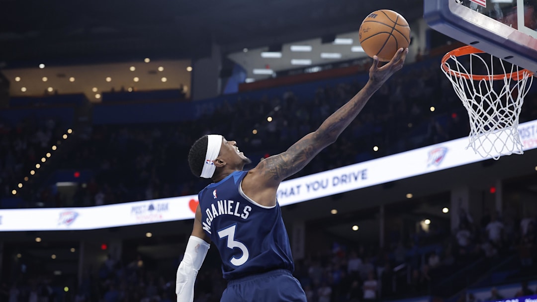 Feb 24, 2025; Oklahoma City, Oklahoma, USA; Minnesota Timberwolves forward Jaden McDaniels (3) shoots against the Oklahoma City Thunder during the second half at Paycom Center. Mandatory Credit: Alonzo Adams-Imagn Images