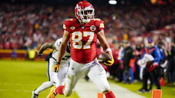 Nov 20, 2023; Kansas City, Missouri, USA; Kansas City Chiefs tight end Travis Kelce (87) scores a touchdown against Philadelphia Eagles cornerback Darius Slay (2) during the first half at GEHA Field at Arrowhead Stadium. Mandatory Credit: Jay Biggerstaff-Imagn Images