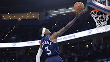 Feb 24, 2025; Oklahoma City, Oklahoma, USA; Minnesota Timberwolves forward Jaden McDaniels (3) shoots against the Oklahoma City Thunder during the second half at Paycom Center. Mandatory Credit: Alonzo Adams-Imagn Images