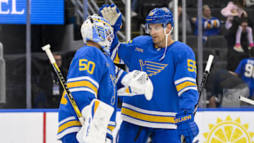 Oct 2, 2025; St. Louis, Missouri, USA; St. Louis Blues goaltender Jordan Binnington (50) celebrates with defenseman Colton Parayko (55) after the Blues defeated the Ottawa Senators at Enterprise Center. Mandatory Credit: Jeff Curry-Imagn Images