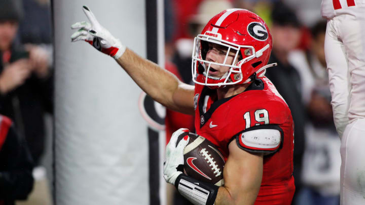 Georgia tight end Brock Bowers (19) scores a touchdown during the second half of a NCAA college football game against Ole Miss in Athens, Ga., on Saturday, Nov. 11, 2023. Georgia won 52-17.