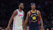 Mar 25, 2025; Miami, Florida, USA; Golden State Warriors forward Jimmy Butler III (10) and Miami Heat guard Alec Burks (18) look on during the second quarter at Kaseya Center. Mandatory Credit: Sam Navarro-Imagn Images
