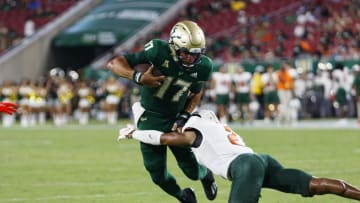 Sep 9, 2023; Tampa, Florida, USA; Florida A&M Rattlers defensive back Javan Morgan (2) tackles South Florida Bulls quarterback Byrum Brown (17) during the second quarter at Raymond James Stadium. Mandatory Credit: Morgan Tencza-USA TODAY Sports