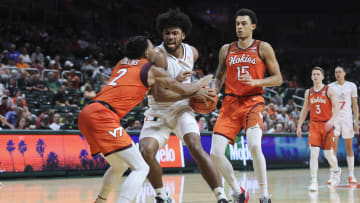 Feb 3, 2024; Coral Gables, Florida, USA; Miami Hurricanes forward Norchad Omier (15) drives to the basket against Virginia Tech Hokies guard MJ Collins (2) during the second half at Watsco Center. Mandatory Credit: Sam Navarro-USA TODAY Sports