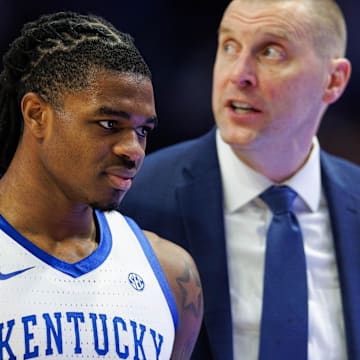 Feb 11, 2025; Lexington, Kentucky, USA; Kentucky Wildcats guard Otega Oweh (00) returns to the bench during the first half against the Tennessee Volunteers at Rupp Arena at Central Bank Center. Mandatory Credit: Jordan Prather-Imagn Images