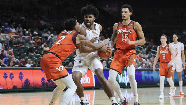 Feb 3, 2024; Coral Gables, Florida, USA; Miami Hurricanes forward Norchad Omier (15) drives to the basket against Virginia Tech Hokies guard MJ Collins (2) during the second half at Watsco Center. Mandatory Credit: Sam Navarro-USA TODAY Sports