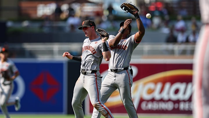 Sep 8, 2024; San Diego, California, USA; San Francisco Giants shortstop Tyler Fitzgerald (49), left, and second baseman Marco Luciano (37) collide while trying to catch a fly ball from San Diego Padres left fielder Jurickson Profar (not pictured) during the seventh inning at Petco Park.