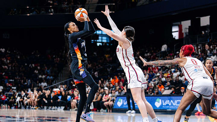 Jul 27, 2025; Washington, District of Columbia, USA; Phoenix Mercury forward DeWanna Bonner (14) shoots the ball over Washington Mystics guard Jade Melbourne (5) in the second half at CareFirst Arena. Mandatory Credit: Emily Faith Morgan-Imagn Images Jul 27, 2025; Washington, District of Columbia, USA; Phoenix Mercury forward DeWanna Bonner (14) shoots the ball over Washington Mystics guard Jade Melbourne (5) in the second half at CareFirst Arena. Mandatory Credit: Emily Faith Morgan-Imagn Images