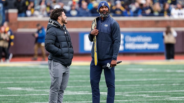 Former Michigan running back Blake Corum talks Charles Woodson during the spring game at Michigan Stadium in Ann Arbor on Saturday, April 20, 2024.