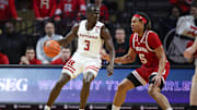 Jan 9, 2024; Piscataway, New Jersey, USA; Rutgers Scarlet Knights forward Mawot Mag (3) dribbles against Indiana Hoosiers forward Malik Reneau (5) during the first half at Jersey Mike's Arena. Mandatory Credit: Vincent Carchietta-USA TODAY Sports