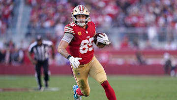 Dec 8, 2024; Santa Clara, California, USA; San Francisco 49ers tight end George Kittle (85) runs with the ball after making a catch against the Chicago Bears in the second quarter at Levi's Stadium. Mandatory Credit: Cary Edmondson-Imagn Images