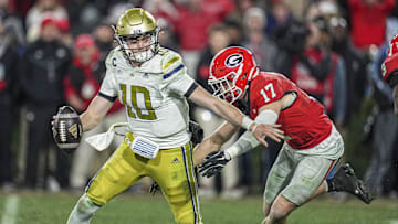 Nov 29, 2024; Athens, Georgia, USA; Georgia Bulldogs defensive back Dan Jackson (17) sacks Georgia Tech Yellow Jackets quarterback Haynes King (10) during overtime at Sanford Stadium. Mandatory Credit: Dale Zanine-Imagn Images