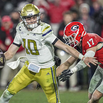 Nov 29, 2024; Athens, Georgia, USA; Georgia Bulldogs defensive back Dan Jackson (17) sacks Georgia Tech Yellow Jackets quarterback Haynes King (10) during overtime at Sanford Stadium. Mandatory Credit: Dale Zanine-Imagn Images
