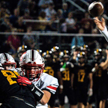 Algona's Alex Manske attempts a pass during a game at Lions Field on Friday, Sept. 29, 2023, in Clear Lake.