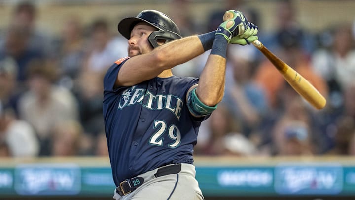 Seattle Mariners catcher Cal Raleigh hits a two run home run against the Minnesota Twins in the ninth inning at Target Field. Seattle Mariners catcher Cal Raleigh hits a two run home run against the Minnesota Twins in the ninth inning at Target Field.