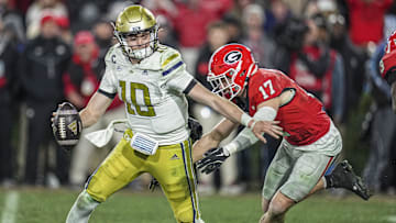 Nov 29, 2024; Athens, Georgia, USA; Georgia Bulldogs defensive back Dan Jackson (17) sacks Georgia Tech Yellow Jackets quarterback Haynes King (10) during overtime at Sanford Stadium. Mandatory Credit: Dale Zanine-Imagn Images