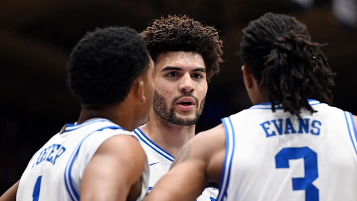 Feb 14, 2026; Durham, North Carolina, USA; Duke basketball forward Cameron Boozer (12) huddles with teammates Caleb Foster (1) and Isaiah Evans (3) during the first half against the Clemson Tigers at Cameron Indoor Stadium.
