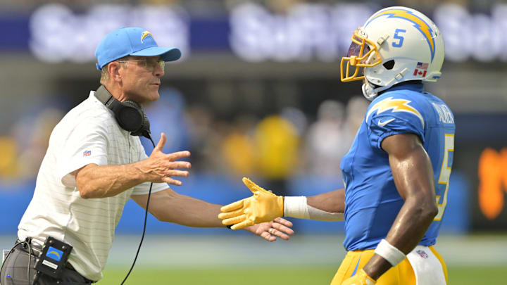 Harbaugh congratulates wide receiver Joshua Palmer after a touchdown in the second half against the Las Vegas Raiders at SoFi Stadium.