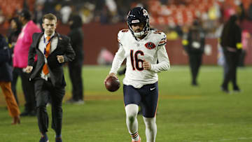 Oct 13, 2025; Landover, Maryland, USA; Chicago Bears kicker Jake Moody (16) runs off the field holding the game ball after making the game winning kick as time expired against the Washington Commanders at Northwest Stadium. Mandatory Credit: Geoff Burke-Imagn Images