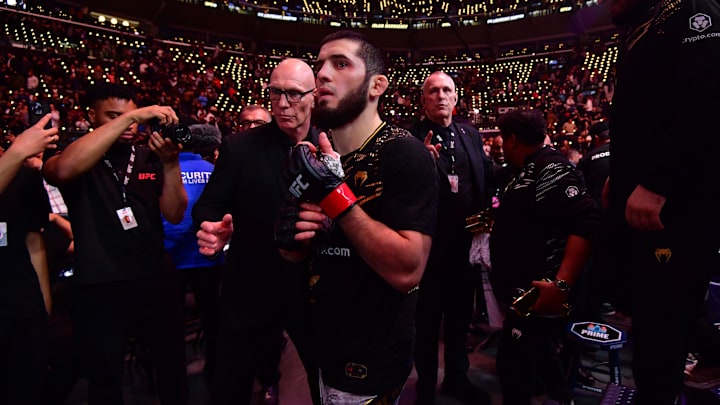 Jan 18, 2025; Inglewood, California, USA; Islam Makhachev (red gloves) leaves the octagon after defeating Renato Moicano (not pictured) in a lightweight title fight during UFC 311 at Intuit Dome. Mandatory Credit: Gary A. Vasquez-Imagn Images Jan 18, 2025; Inglewood, California, USA; Islam Makhachev (red gloves) leaves the octagon after defeating Renato Moicano (not pictured) in a lightweight title fight during UFC 311 at Intuit Dome. Mandatory Credit: Gary A. Vasquez-Imagn Images