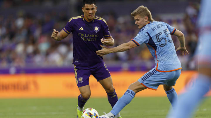 Jul 20, 2024; Orlando, Florida, USA; New York City FC midfielder Keaton Parks (55) tackles the ball away from Orlando City midfielder Cesar Araujo (5) during the first half at Inter&Co Stadium. Mandatory Credit: Morgan Tencza-USA TODAY Sports