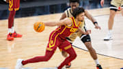 Mar 13, 2025; Indianapolis, IN, USA; USC Trojans guard Desmond Claude (1) dribbles the ball while Purdue Boilermakers guard Myles Colvin (5) defends in the second half at Gainbridge Fieldhouse. Mandatory Credit: Trevor Ruszkowski-Imagn Images