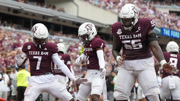 Sep 6, 2025; College Station, Texas, USA; Texas A&M Aggies wide receivers and guard Ar'maj Reed-Adams celebrate a touchdown.