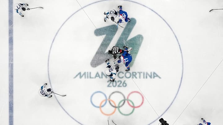 [US, Mexico & Canada customers only] Feb 11, 2026; Milan, Italy; Anton Lundell of Finland and Adam Ruzicka of Slovakia during opening face off  in men's ice hockey group B play during the Milano Cortina 2026 Olympic Winter Games at Milano Santagiulia Ice Hockey Arena. Mandatory Credit: David W Cerny/Reuters via Imagn Images