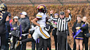Nov 22, 2025; Chicago, Illinois, USA; Minnesota Golden Gophers wide receiver Javon Tracy (11) runs in for a touchdown against the Northwestern Wildcats during the first half at Wrigley Field. Mandatory Credit: Patrick Gorski-Imagn Images