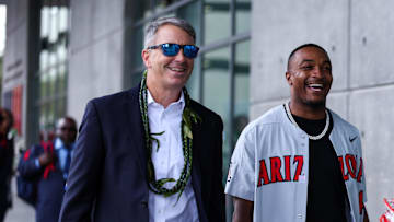 Oct 19, 2024; Tucson, Arizona, USA; Arizona Wildcats head coach Brent Brennan walks with honorary captain Khalil Tate down the Wildcat Walk before the game against Colorado Buffaloes at Arizona Stadium. Mandatory Credit: Aryanna Frank-Imagn Images