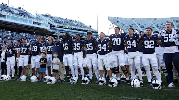 Penn State Nittany Lions players sing their alma mater following their win over the Nevada Wolf Pack at Beaver Stadium.