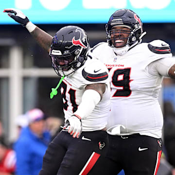 Oct 13, 2024; Foxborough, Massachusetts, USA; Houston Texans running back Dameon Pierce (31) celebrates with guard Shaq Mason (69) after scoring a touchdown against the New England Patriots during the second half at Gillette Stadium. Mandatory Credit: Brian Fluharty-Imagn Images