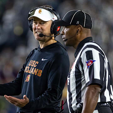 Oct 18, 2025; South Bend, Indiana, USA; Southern California Trojans head coach Lincoln Riley talks to an official during the first half against the Notre Dame Fighting Irish at Notre Dame Stadium. Mandatory Credit: Michael Caterina-Imagn Images