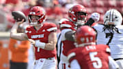 Sep 20, 2025; Louisville, Kentucky, USA;  Louisville Cardinals quarterback Miller Moss (7) looks to pass against the Bowling Green Falcons during the second half at L&N Federal Credit Union Stadium. Louisville defeated Bowling Green 40-17. Mandatory Credit: Jamie Rhodes-Imagn Images