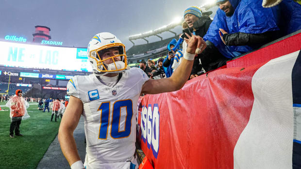 Dec 3, 2023; Foxborough, Massachusetts, USA; Los Angeles Chargers quarterback Justin Herbert (10) is congratulated by fans af