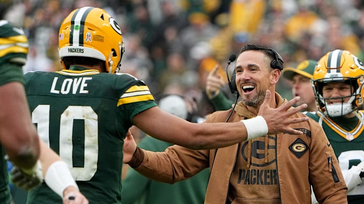 Green Bay Packers quarterback Jordan Love and coach Matt LaFleur celebrate a touchdown vs. the Rams last year.