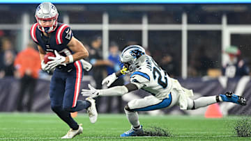 Aug 8, 2024; Foxborough, Massachusetts, USA; New England Patriots wide receiver David Wallis (30) returns the ball against Carolina Panthers cornerback D'Shawn Jamison (29) during the first half at Gillette Stadium. Mandatory Credit: Brian Fluharty-USA TODAY Sports