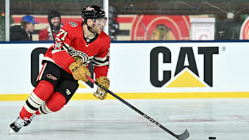 Dec 31, 2024; Chicago, Illinois, USA; Chicago Blackhawks left wing Taylor Hall (71) skates with the puck against the St. Louis Blues during the third period in the Winter Classic at Wrigley Field. Mandatory Credit: Daniel Bartel-Imagn Images