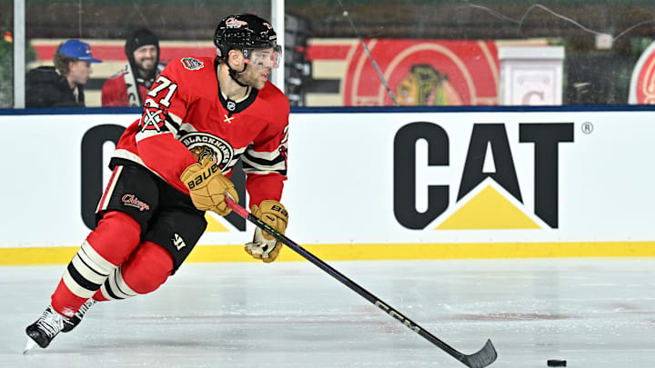 Dec 31, 2024; Chicago, Illinois, USA; Chicago Blackhawks left wing Taylor Hall (71) skates with the puck against the St. Louis Blues during the third period in the Winter Classic at Wrigley Field. Mandatory Credit: Daniel Bartel-Imagn Images